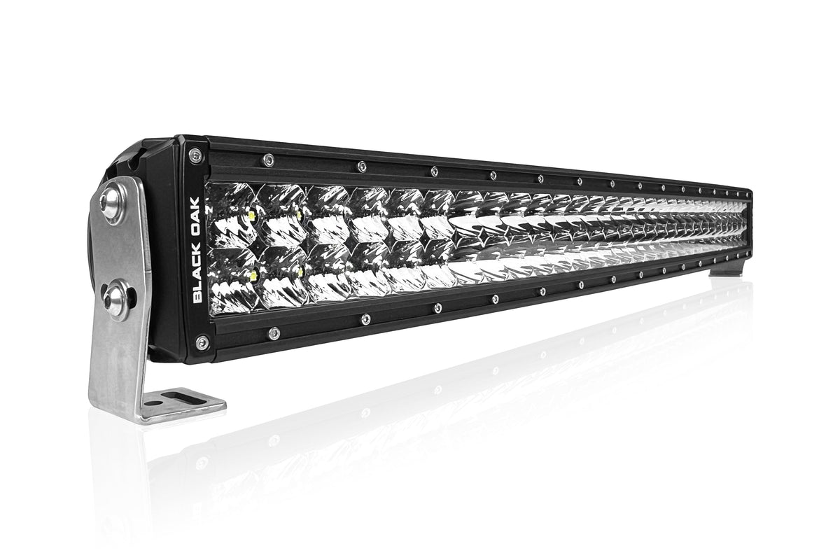 A 30-inch curved double row light bar in a Chevy Silverado 1500 grille kit, a typical pickup truck grille light bar fitment.
