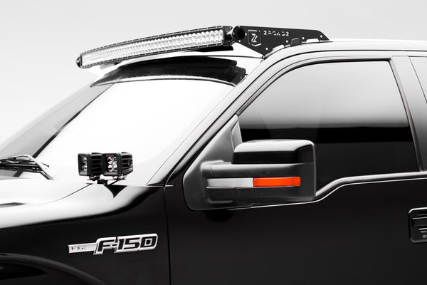A Black Oak LED light bar mounted on the front end of a Ford Raptor, the front-mounted light bar setup described in this story.