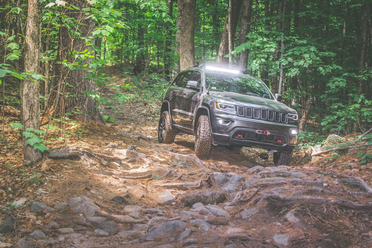 A Jeep Trailhawk parked in remote backcountry on a long overland run, the Jeep community Black Oak LED shows up for at events like Jeep Beach.