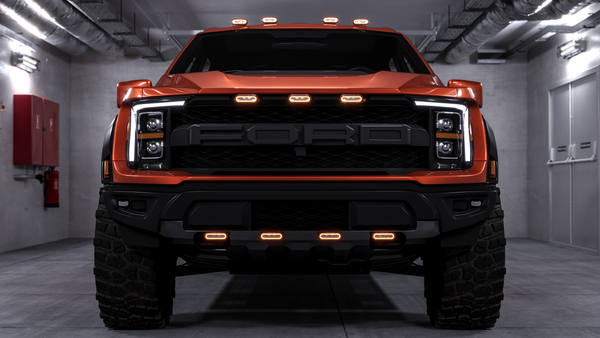 A front view of a Ford pickup with Black Oak LED auxiliary lighting installed, a Ford pickup of the type wired to factory auxiliary switches in this guide.